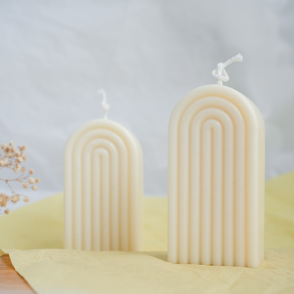 Handmade rainbow arch pillar candle made of soy wax in colour ivory with a lead-free wick. Customization options available for decorative candles in UAE at minoocandles dot com