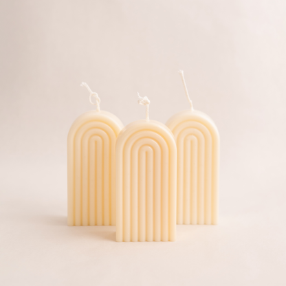 Handmade rainbow arch pillar candle made of soy wax in colour ivory with a lead-free wick. Customization options available for decorative candles in UAE at minoocandles dot com