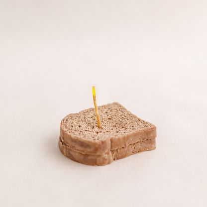 Handmade brown toast slice bread candle made of soy wax. Perfect for birthday or school student event gift ideas, corporate gifts, order today at minoocandles dot com